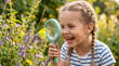 © Torvim - Little girl smiling through magnifying glass at yellow butterfly