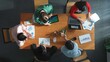 © InfiniteFlow - Time lapse of diverse business people working together to analyze chart. Top down aerial view of creative team looking at stock market report and discussing about financial investment. Convocation.