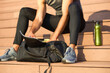 © Teodor Lazarev - Athlete packing gym bag for workout session