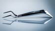 © SHI - shortcoming. A stainless steel dental facebow isolated on a neutral background. STEM education sheets, lab safety posters, designed for biotech research communications, used by nutritionists.