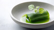 © Igor - Fresh Green Leaf Roll on White Plate