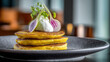 © Igor - Stacked Golden Pancakes with Fresh Herbs and White Cream