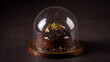 © Igor - Chocolate Dessert Under Glass Dome with Gold Leaf