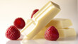© Igor - White chocolate bar with raspberries on a reflective surface