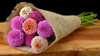 © Igor - Colorful flowers in natural burlap bundle on wooden table