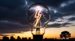 © MD. Sattar - Electric light bulb with lightning bolt at sunset