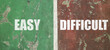 © Reza - EASY and DIFFICULT text in white bold font, separated by a white vertical line on a weathered green and red pavement surface.