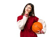 © luismolinero - Young Russian woman playing basketball over isolated chroma key background and looking up