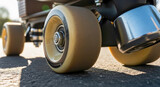 Close up detail of roller skating on urban street with large urethane wheels on asphalt surface. Sports gear for roller skating on urban street provides smooth ride for enthusiasts and hobbyists.