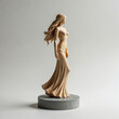 © miss irine - Wooden sculpture of a woman in a flowing dress stands on gray pedestal. Elegant female figure has long wavy hair. Art piece has minimalist design and clean lines.