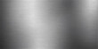 © QUALITY BOOST - A polished silver brushed metal texture background with a shiny stainless steel surface and industrial grey aluminum plate pattern featuring chrome material reflections