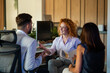 © Zoran Jesic - Business team discussing financial strategy in modern office