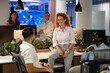 © Zoran Jesic - Diverse business team sharing ideas during casual office meeting