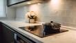 © irawan - Modern Kitchen Countertop with Induction Stove and Cooking Pot.