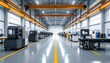 © Yeane - Bright industrial factory interior with machinery and overhead crane system.