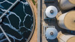 © Jasmine - Aerial view municipal wastewater treatment plant. Circular sedimentation tanks or biological reactor, Water cleaning facility wastewater treatment plant, Water treatment plant.