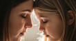 © ManuStockStudio - Mother and daughter bonding moment warm soft light emotional connection family love
