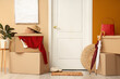 © Pixel-Shot - Cardboard boxes with things in hallway on moving day