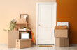 © Pixel-Shot - Cardboard boxes with things near door in hallway on moving day