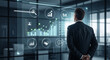 © Rifdah Hanifah - Businessman analyzing data on digital display.
