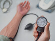 © sidoel98 - Analog Sphygmomanometer in hand for measuring blood pressure with stethoscope and digital blood presure in the white background, health care concept