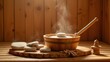 © rahwik - wooden bucket ladle and hot sauna stones in traditional steam sauna wellness spa relaxation concept