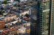 © yaqui_villegas - Crisp daylight aerial of Frankfurt Germany financial district reveals a city rooftop view with skyscraper architecture defining the urban core