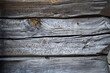 © Travel 'n' Lifestyle - View of weathered wooden planks, marked by time and tiny holes, creating a textured pattern, a rustic charm in Bryggen, Bergen, Norway.