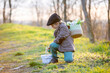 © Tomsickova - Beautiful stylish toddler child, boy, playing with Easter decoration in the park, springtime