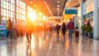 © red_orange_stock - Busy airport terminal with people moving during sunset hours