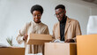 © dinatychynska - Couple packing cardboard boxes moving home together. Man woman entrepreneurs preparing online orders shipping packages. Small business ecommerce delivery relocation storage logistics concept.