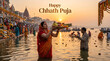 © pritom - Woman in red sari offering prayer with flowers and lamp during chhath puja festival in river at sunset