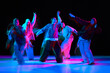 © Lustre Art Group  - Hip hop dancers performing synchronized street dance with neon lighting and motion blur. Urban music culture scene for advertising, entertainment branding, nightlife promotion and youth marketing