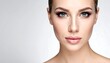 © Abdui - Portrait of a woman with neutral makeup and hair pulled back, against a bright, uniform background