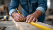 © sabyna75 - Carpenter measuring wooden plank with precision for construction project