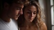 © Thares2020 - A young couple shares a tender intimate moment indoors near a sunlit window
