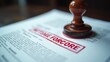 © Mystery - Wooden rubber stamp pressing red foreclosure text on white legal document, official paper with printed text, concept of law, finance, real estate