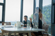 © Surachai - Collaboration meeting among professionals modern office business discussion urban environment close-up view teamwork dynamics