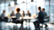 © AamirSohail - Blurred business meeting in modern office, professional team conference, corporate workspace background