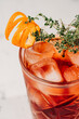 © ADDICTIVE STOCK - Refreshing cocktail with orange garnish in glass