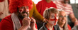 © Halfpoint - Excited football fans supproting English national team in live soccer match at stadium.