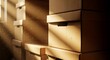 © Tgad - Sunlight streams through a dusty room illuminating stacks of cardboard storage boxes