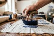 © Stitch - Artisan hand pressing a carved wooden block to print blue patterns on textile fabric