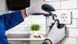 © Garrett - Person Installing Electrical Outlet