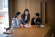 © apichat - Lawyers discussing legal documents with client in office