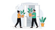 © Farhan - Young couple moving into a new home and carrying beautiful potted plants to decorate their living space.