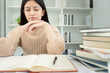 © Shisu_ka - Asian student woman have anxiety because of exams, female prepare for test and learning lessons in the library. stress, despair, haste, misunderstanding reading, discouraged, expectation, knowledge
