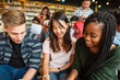 © Rawpixel.com - Diverse students studying together happily.
