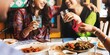 © Rawpixel.com - Two Indian women joyfully share a meal, laughing and toasting with drinks. The vibrant atmosphere highlights friendship, culture, and Indian food, creating a memorable dining experience.