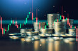 © Keaw - Stacks of coins with stock market candlestick chart illustrate financial trading, investment strategy, market volatility, profit potential, and wealth creation in modern global financial markets.